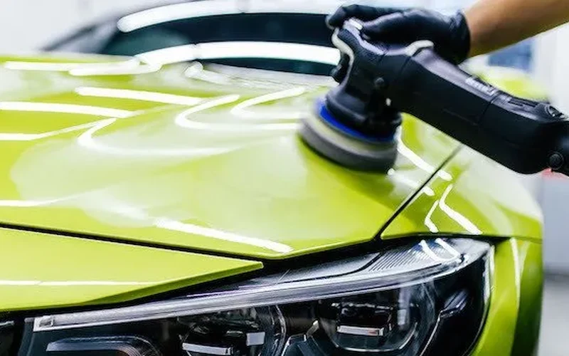 Rotary machine polisher refining vehicle paint surface